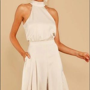 Wide leg jumpsuit ties in back side pockets